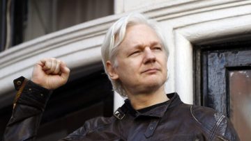 FILE – In this May 19, 2017 file photo, WikiLeaks founder Julian Assange greets supporters outside the Ecuadorian embassy in London, where he has been in self imposed exile since 2012. (AP Photo/Frank Augstein, File)