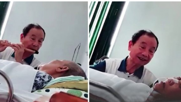 Cụ ông hát bên giường bệnh của vợ. Nguồn ảnh: tinmoi.vn